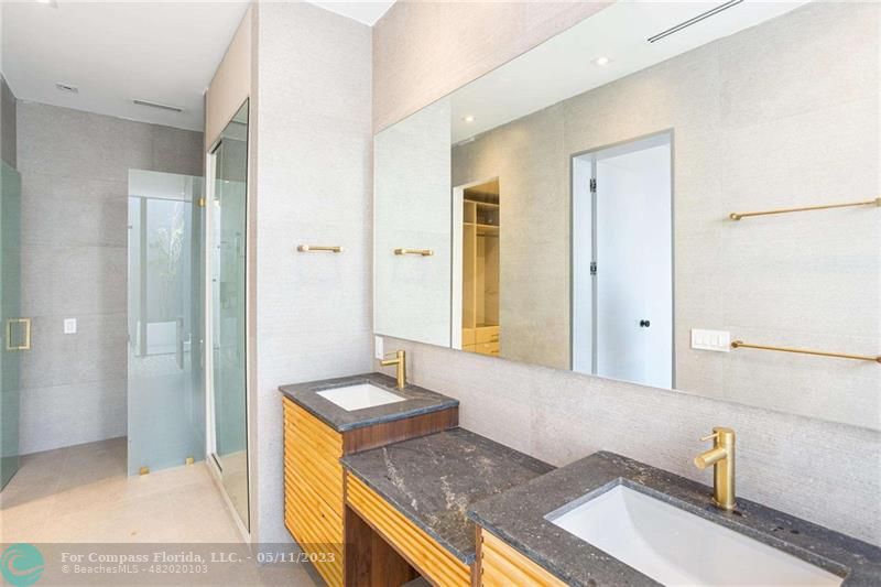 1904 Southwest 22nd Terrace Miami, FL 33145 - Photo 17 of 31 a bathroom with a granite countertop sink and a mirror