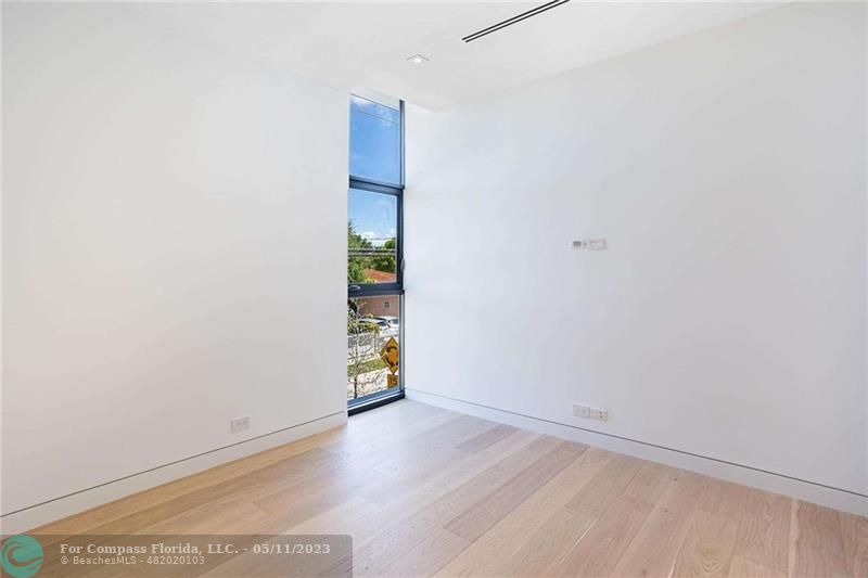 1904 Southwest 22nd Terrace Miami, FL 33145 - Photo 10 of 31 an empty room with wooden floor
