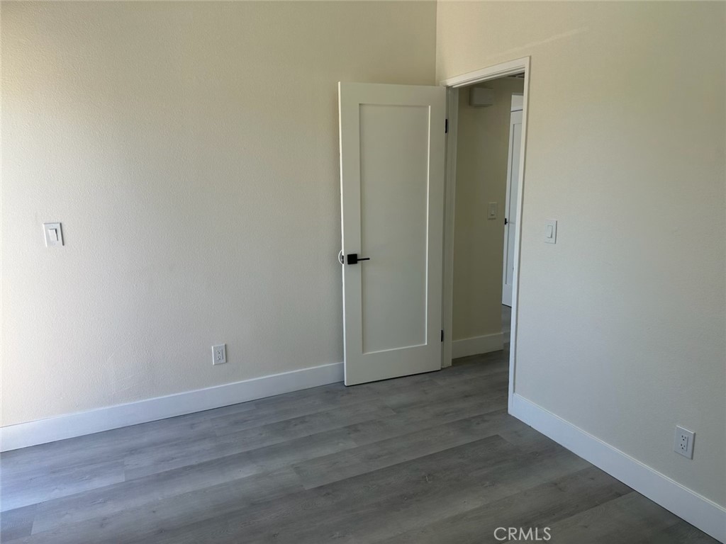 44155 10th Lancaster, CA 93534 - Photo 10 of 15 an empty room with wooden floor