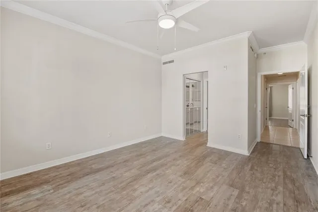 a bathroom with a glass shower door and mirror