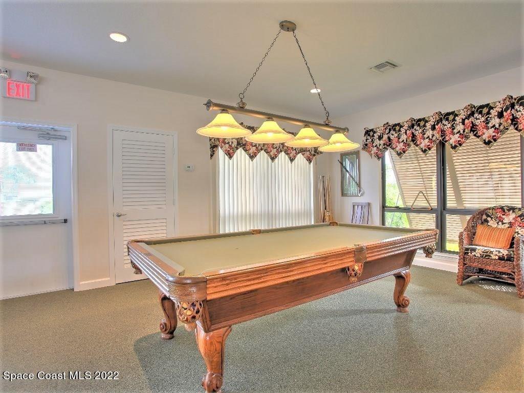 Undisclosed Address Sebastian, FL 32958 - Photo 11 of 33 a room with gym equipment and large windows