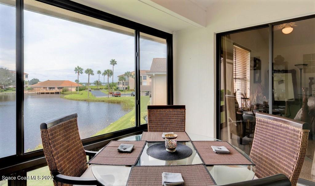 Undisclosed Address Sebastian, FL 32958 - Photo 16 of 33 a living room with furniture and a floor to ceiling window