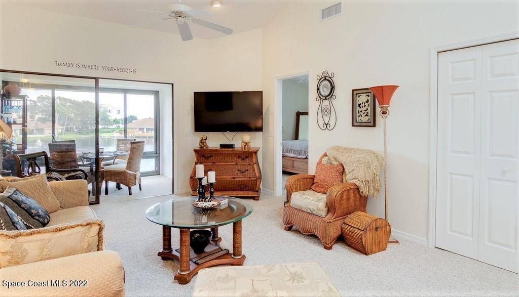 Undisclosed Address Sebastian, FL 32958 - Photo 17 of 33 a living room with furniture a flat screen tv and a large window