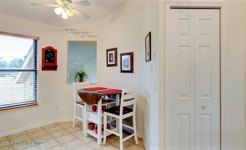 Undisclosed Address Sebastian, FL 32958 - Photo 22 of 33 a room that has a rug and a chandelier