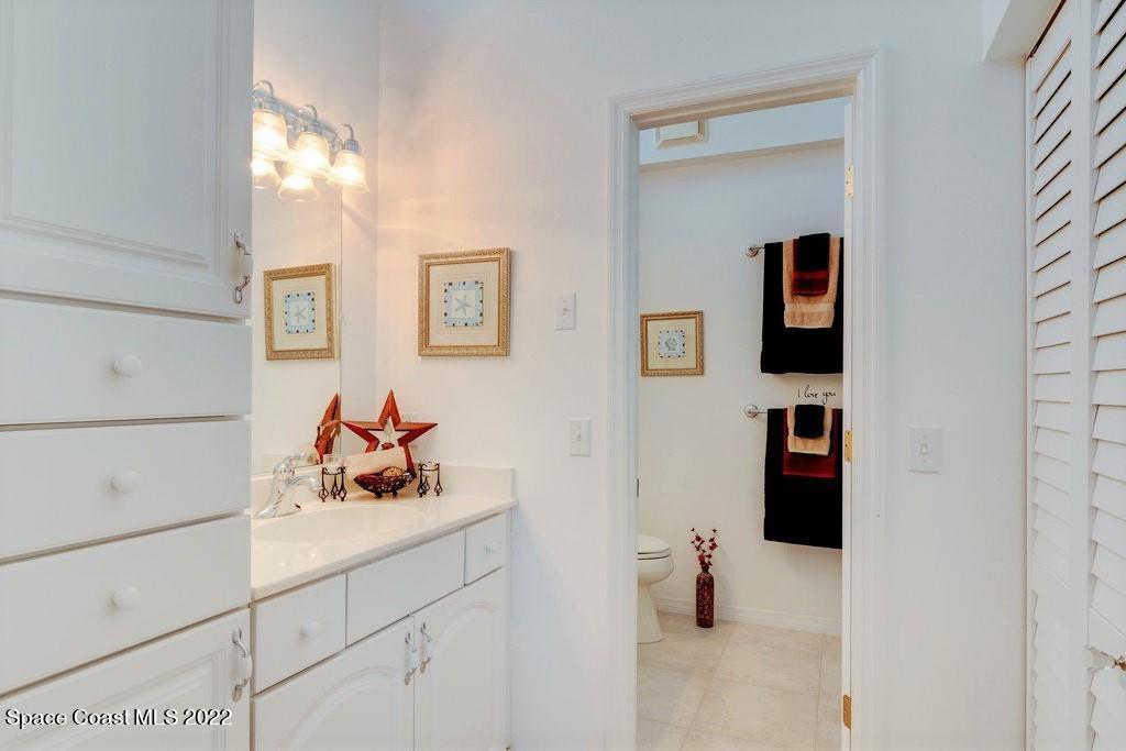 Undisclosed Address Sebastian, FL 32958 - Photo 25 of 33 a bathroom with a sink and a mirror