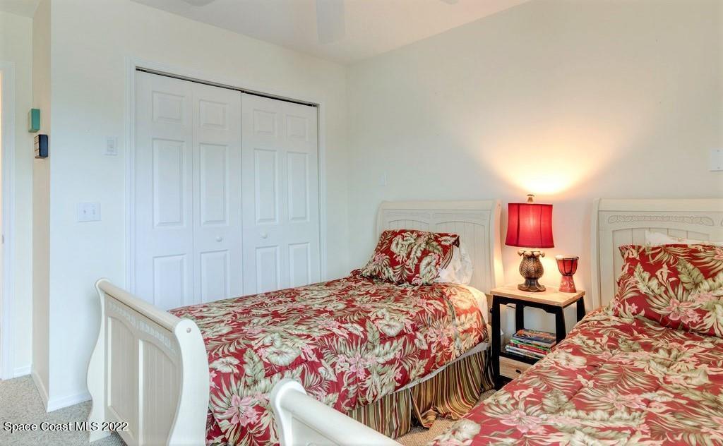 Undisclosed Address Sebastian, FL 32958 - Photo 28 of 33 a bedroom with a bed and wooden floor