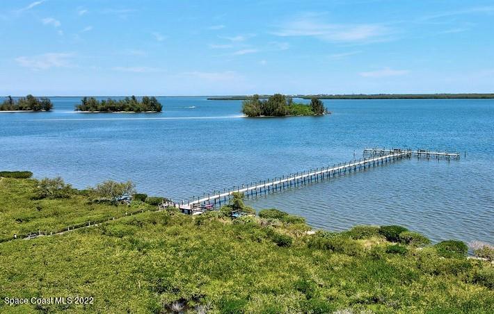 Undisclosed Address Sebastian, FL 32958 - Photo 4 of 33 a view of a lake with a yard