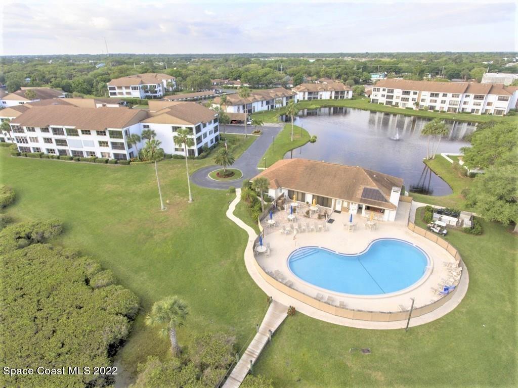 Undisclosed Address Sebastian, FL 32958 - Photo 6 of 33 a swimming pool with outdoor seating and lake view