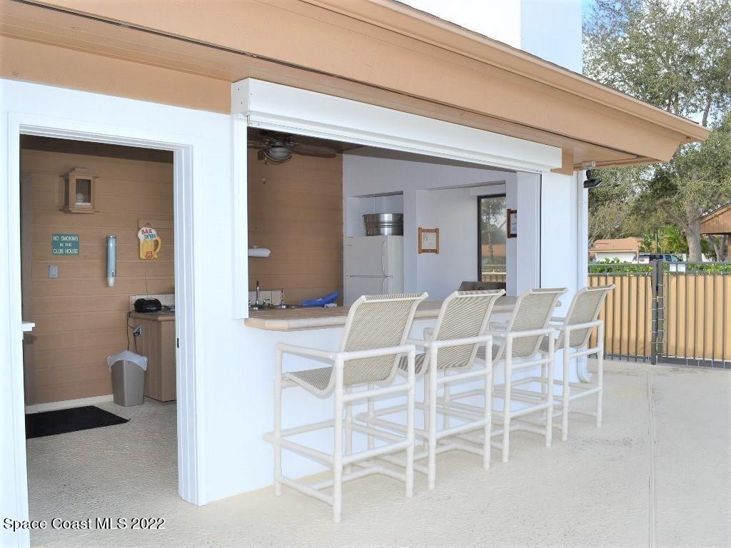 Undisclosed Address Sebastian, FL 32958 - Photo 8 of 33 a dining room with a wooden table and chairs