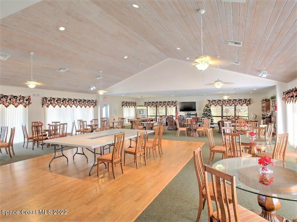 Undisclosed Address Sebastian, FL 32958 - Photo 10 of 33 a dining hall with lots of tables a large window and chairs