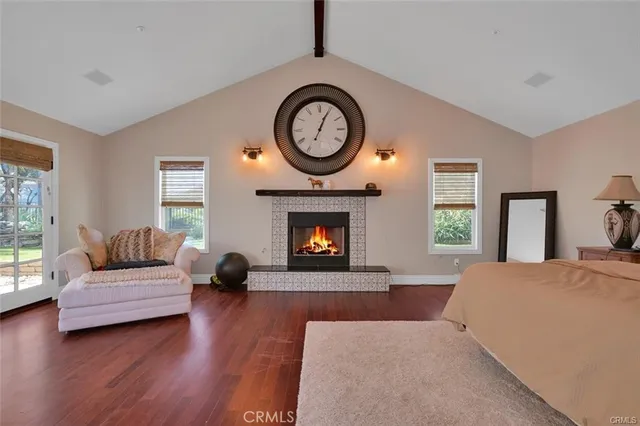 a bedroom with furniture and a fireplace