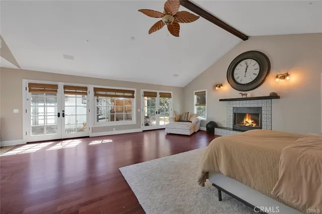 a bedroom with a large bed and a large window