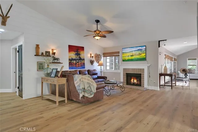 a living room with fireplace furniture and a flat screen tv