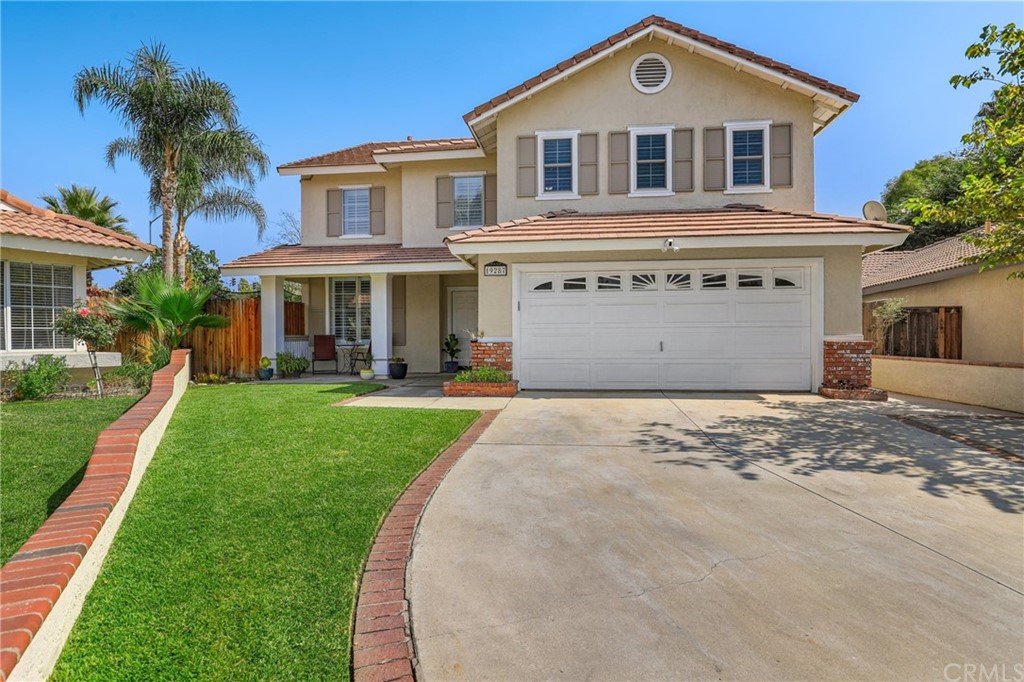19287 Foxtail Lane Riverside, CA 92508 - Photo 1 of 1 a front view of a house with a yard and garage