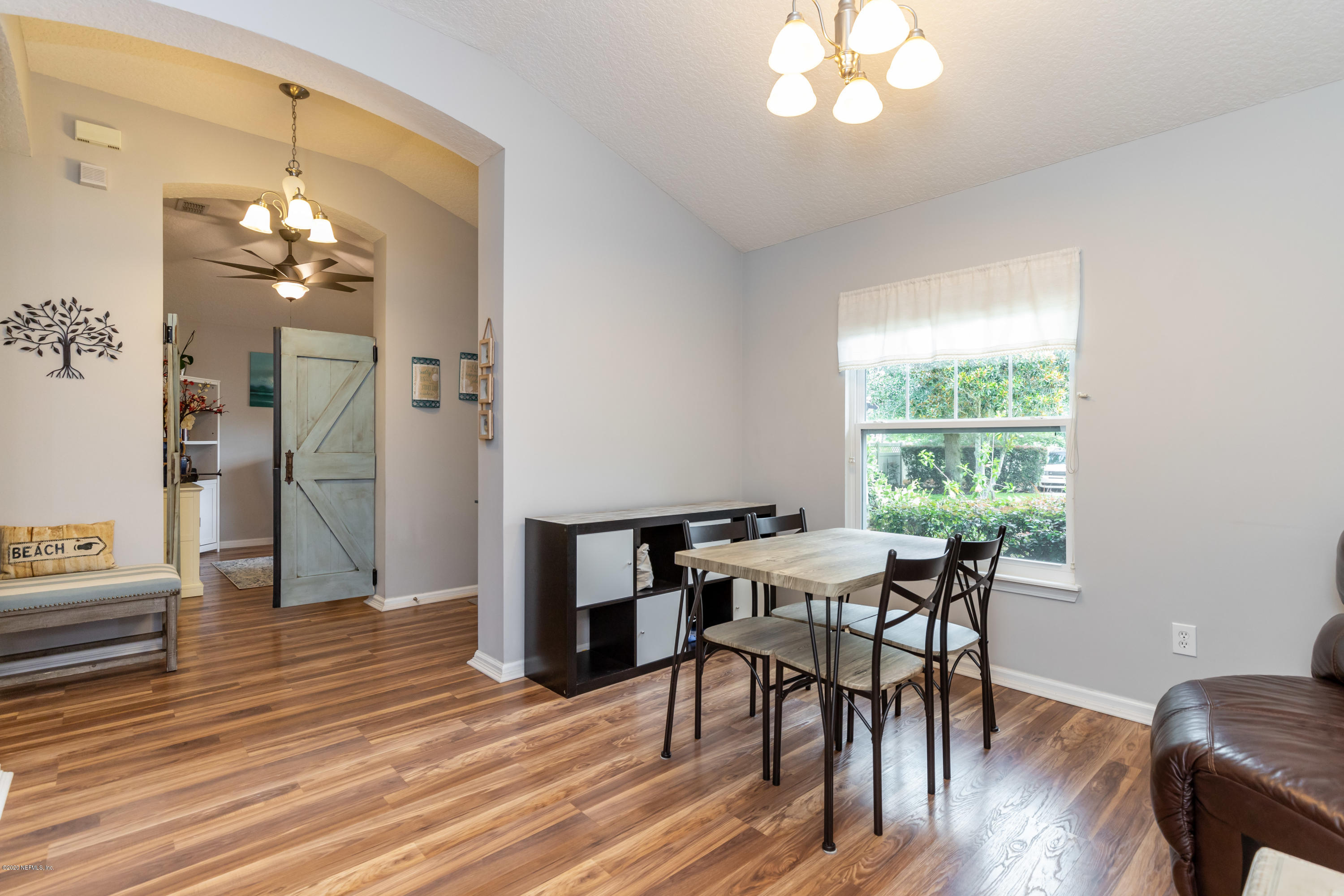 951 Silver Spring Court St. Augustine, FL 32092 - Photo 11 of 40 a view of a dining room with furniture window and wooden floor