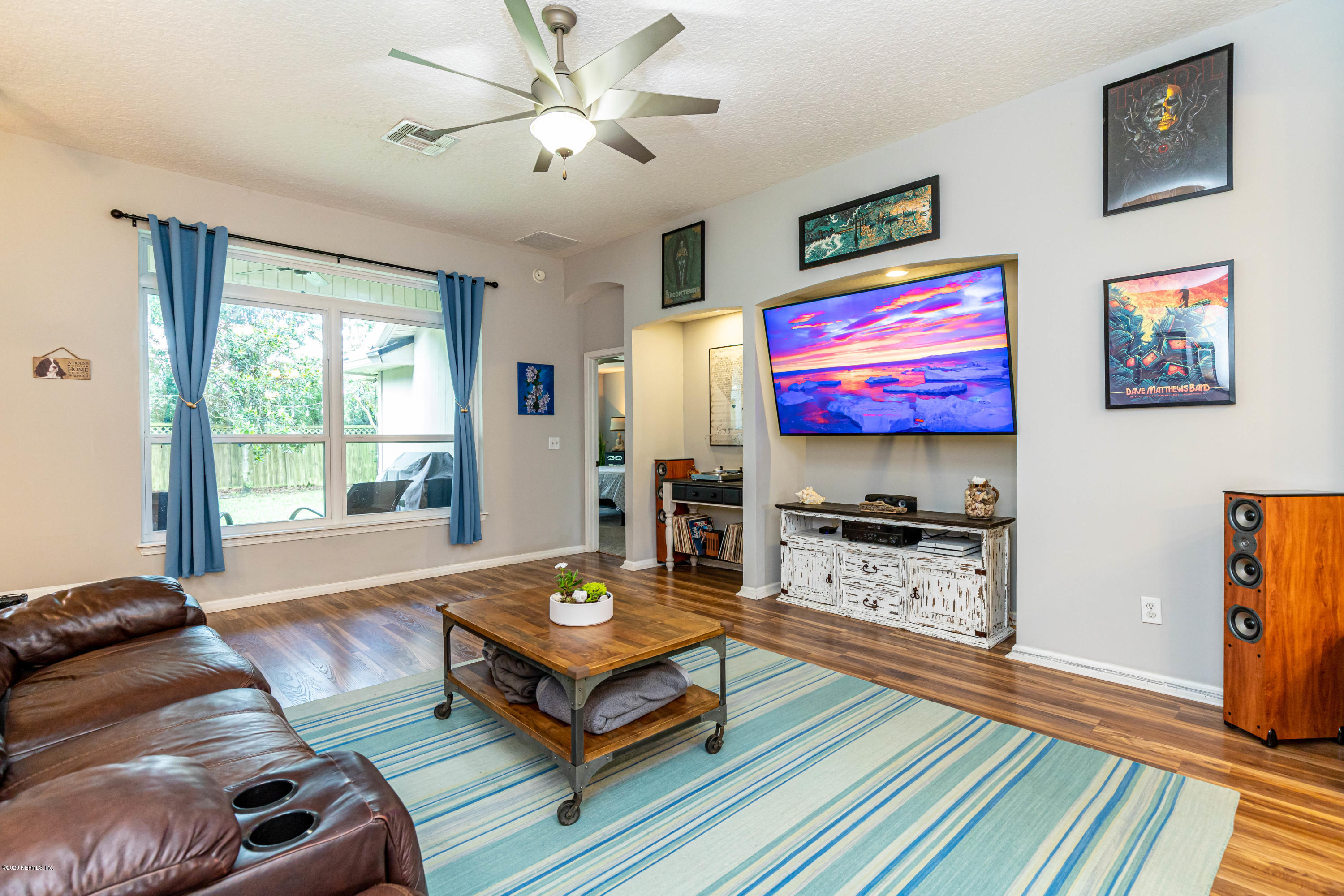 951 Silver Spring Court St. Augustine, FL 32092 - Photo 12 of 40 a living room with furniture and a flat screen tv