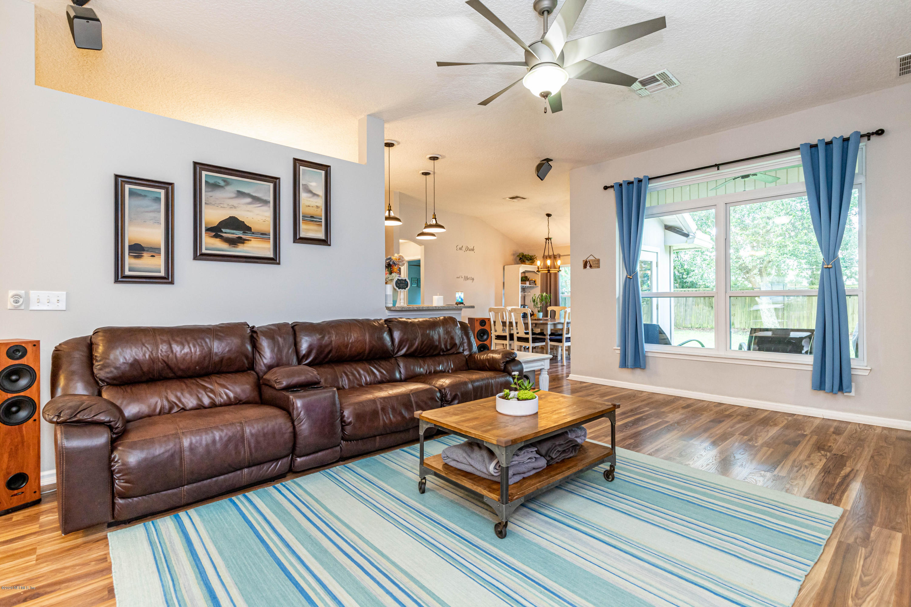 951 Silver Spring Court St. Augustine, FL 32092 - Photo 13 of 40 a living room with furniture a table and a large window