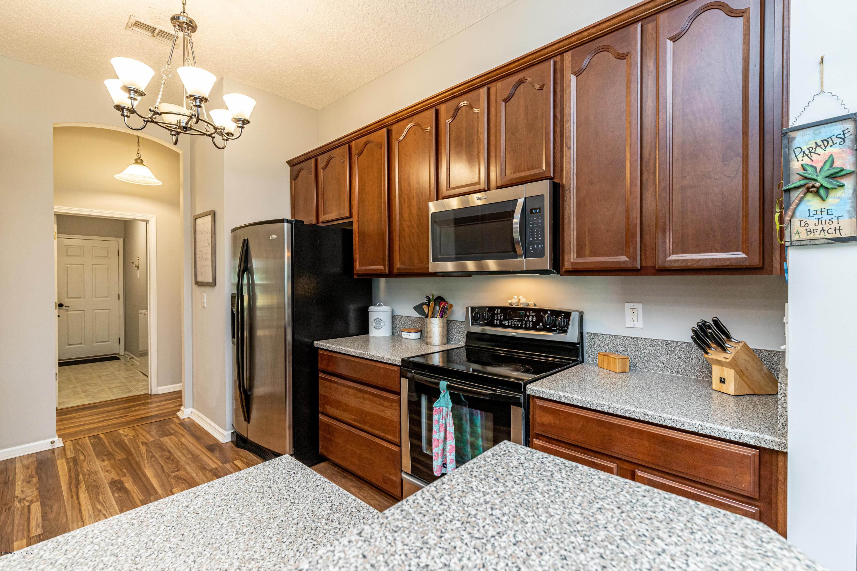 951 Silver Spring Court St. Augustine, FL 32092 - Photo 18 of 40 a kitchen with stainless steel appliances granite countertop a refrigerator and a stove top oven