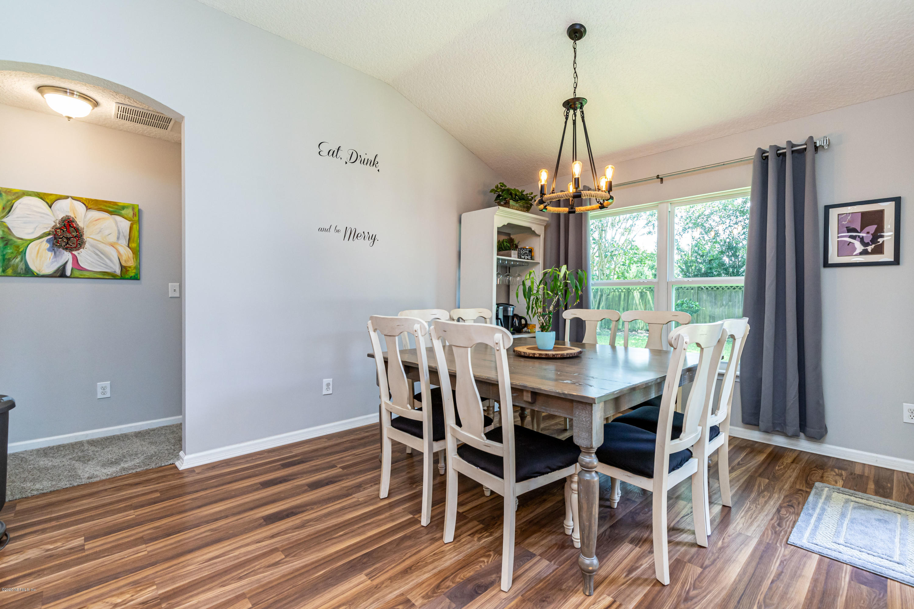 951 Silver Spring Court St. Augustine, FL 32092 - Photo 20 of 40 a view of a dining room with furniture window and wooden floor