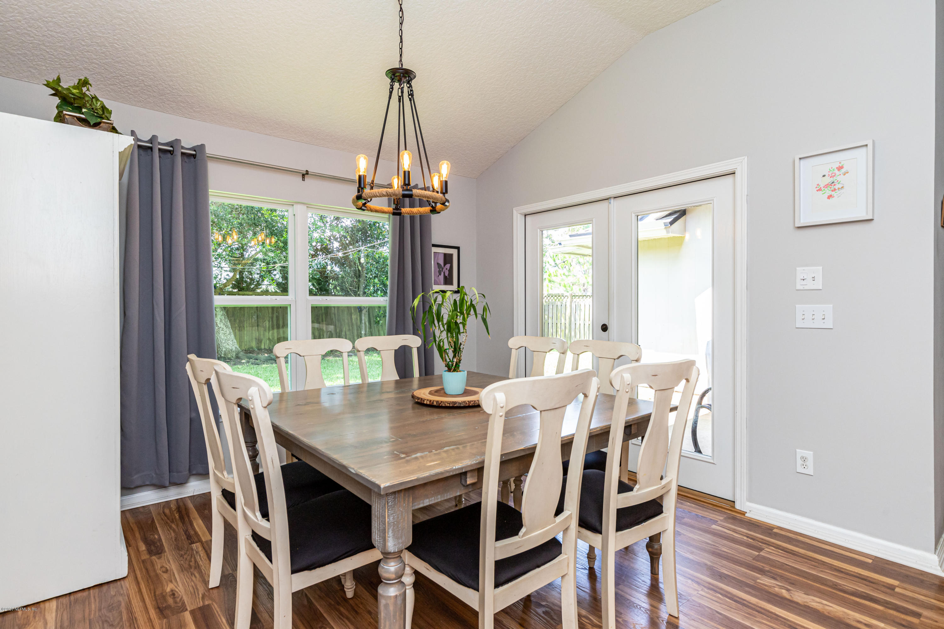 951 Silver Spring Court St. Augustine, FL 32092 - Photo 21 of 40 a view of a dining room with furniture window and wooden floor