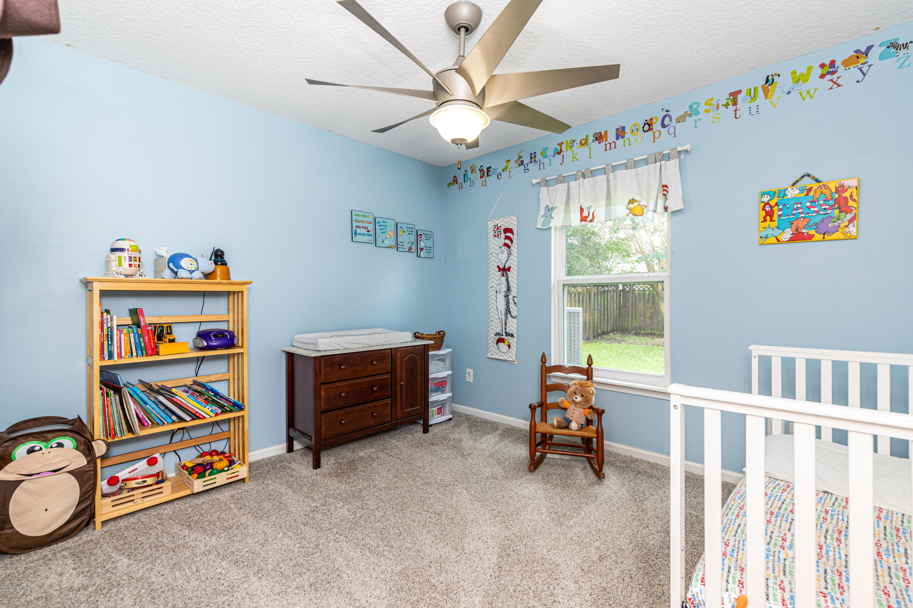 951 Silver Spring Court St. Augustine, FL 32092 - Photo 32 of 40 a view of a bedroom with toys and a chandelier