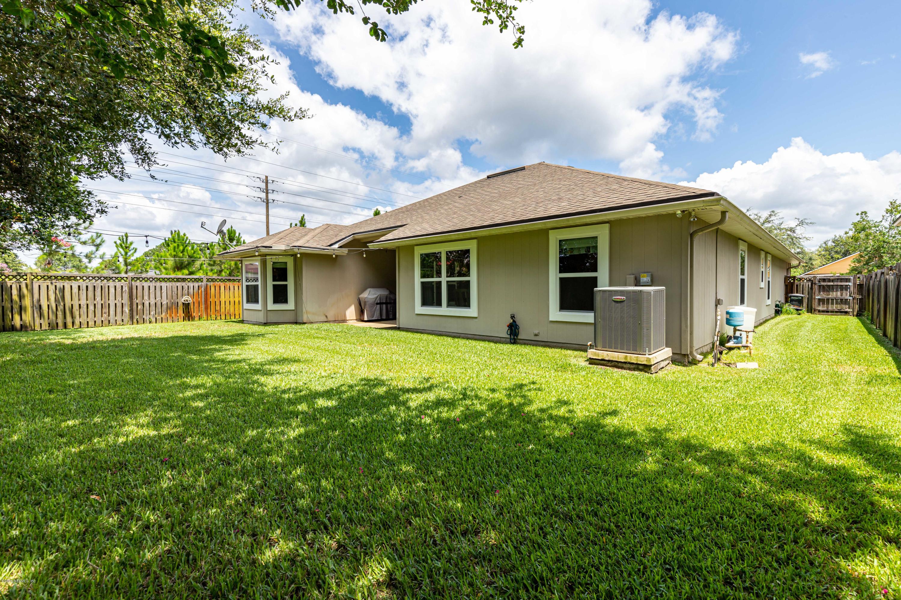 951 Silver Spring Court St. Augustine, FL 32092 - Photo 39 of 40 a front view of house with yard and green space