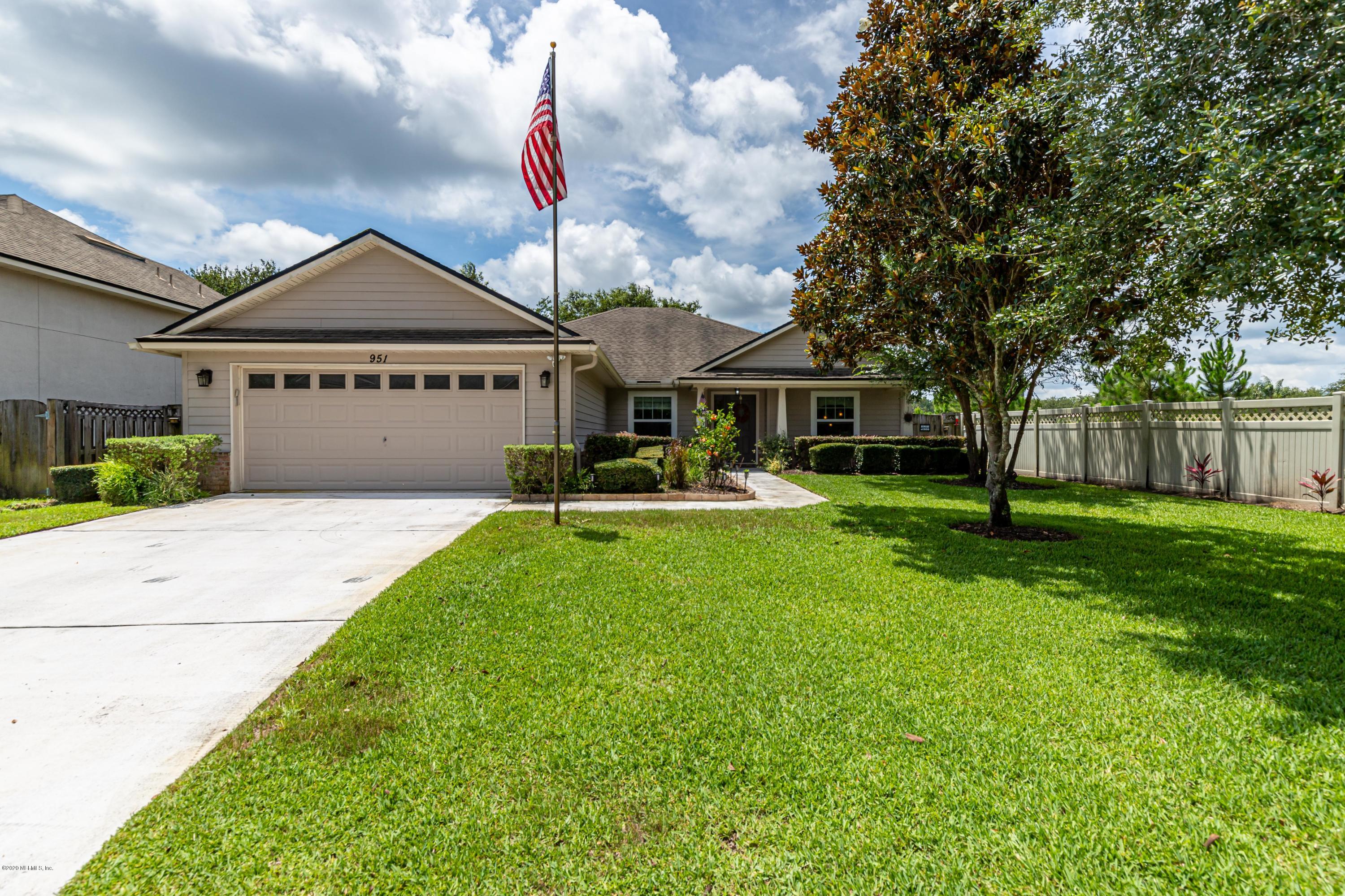 951 Silver Spring Court St. Augustine, FL 32092 - Photo 4 of 40 a front view of a house with a yard