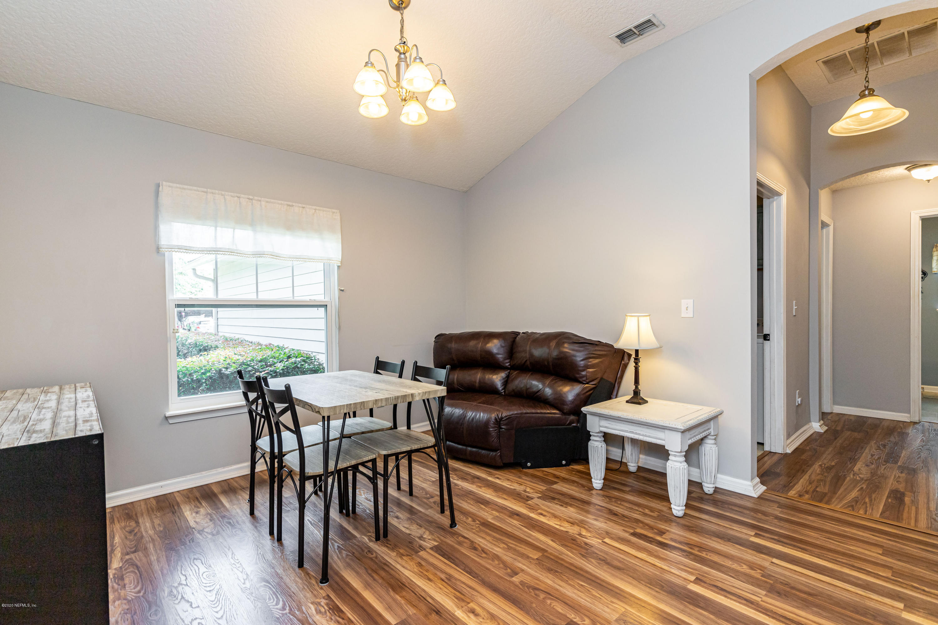 951 Silver Spring Court St. Augustine, FL 32092 - Photo 10 of 40 a living room with furniture a table and a large window