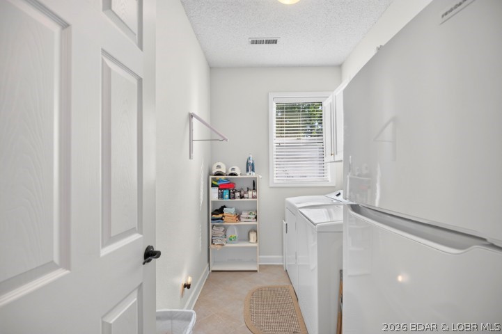 73 Evergreen Road, Unit 3A Sunrise Beach, MO 65079 - Photo 58 of 89 Awesome Laundry Room with cabinets over the washer