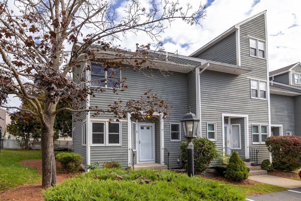 38 Farmland Road, Unit A Lowell, MA 01850 - Photo 1 of 26 a front view of a house with garden