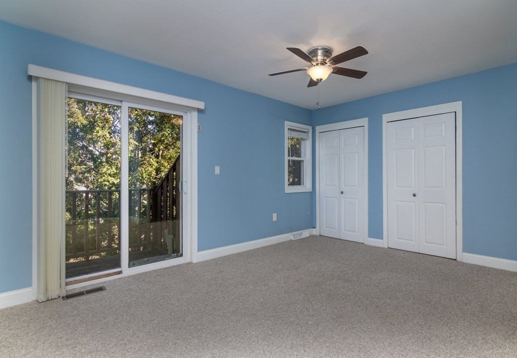 38 Farmland Road, Unit A Lowell, MA 01850 - Photo 11 of 26 a view of an empty room with a ceiling fan and window