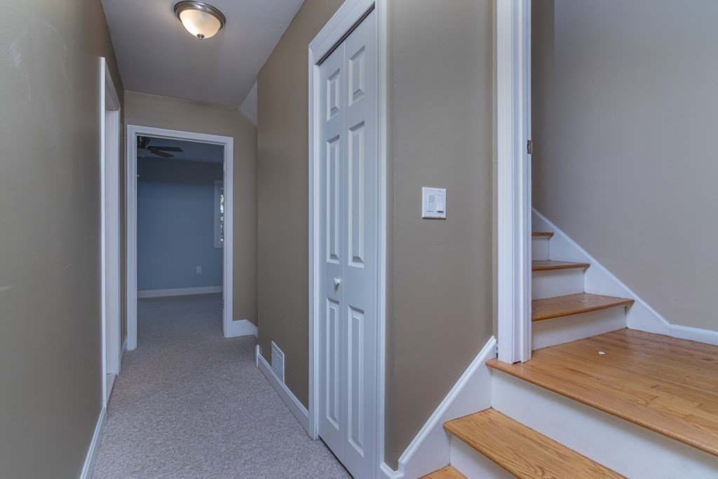 38 Farmland Road, Unit A Lowell, MA 01850 - Photo 18 of 26 a view of a hallway with staircase