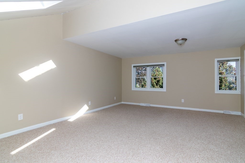 38 Farmland Road, Unit A Lowell, MA 01850 - Photo 20 of 26 an empty room with windows