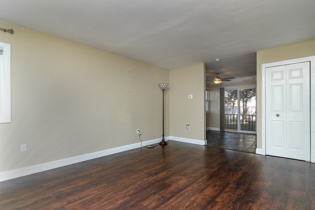 38 Farmland Road, Unit A Lowell, MA 01850 - Photo 2 of 26 a view of an empty room with wooden floor