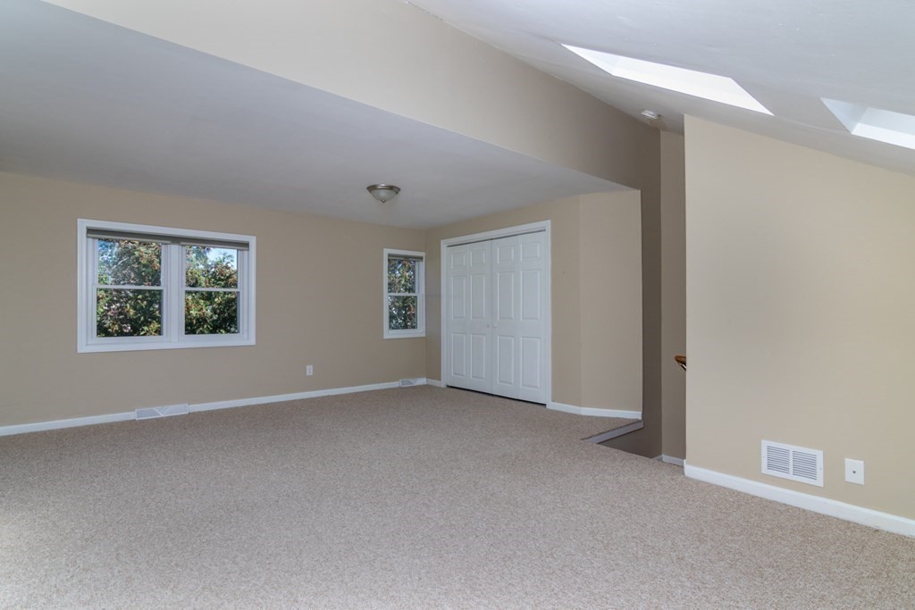 38 Farmland Road, Unit A Lowell, MA 01850 - Photo 21 of 26 an empty room with windows and closet