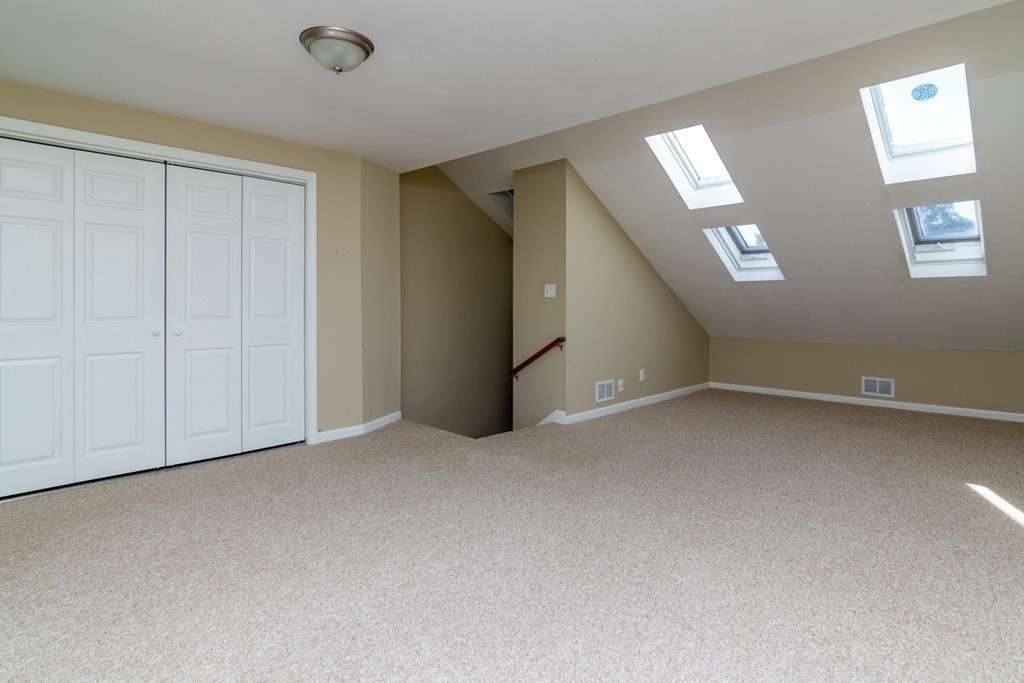 38 Farmland Road, Unit A Lowell, MA 01850 - Photo 22 of 26 an empty room with windows
