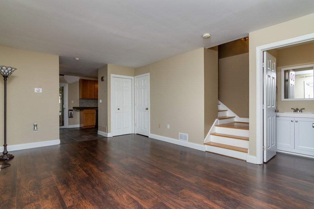 38 Farmland Road, Unit A Lowell, MA 01850 - Photo 3 of 26 an empty room with wooden floor and front door