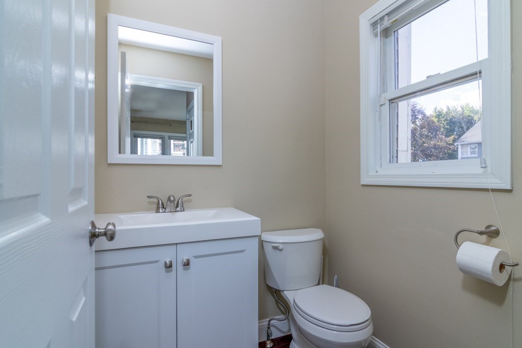 38 Farmland Road, Unit A Lowell, MA 01850 - Photo 5 of 26 a bathroom with a toilet a sink and a window
