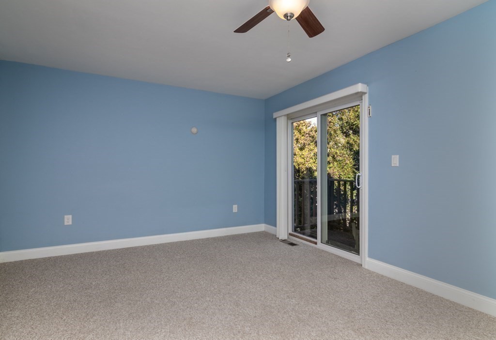 38 Farmland Road, Unit A Lowell, MA 01850 - Photo 10 of 26 an empty room with a ceiling fan and window