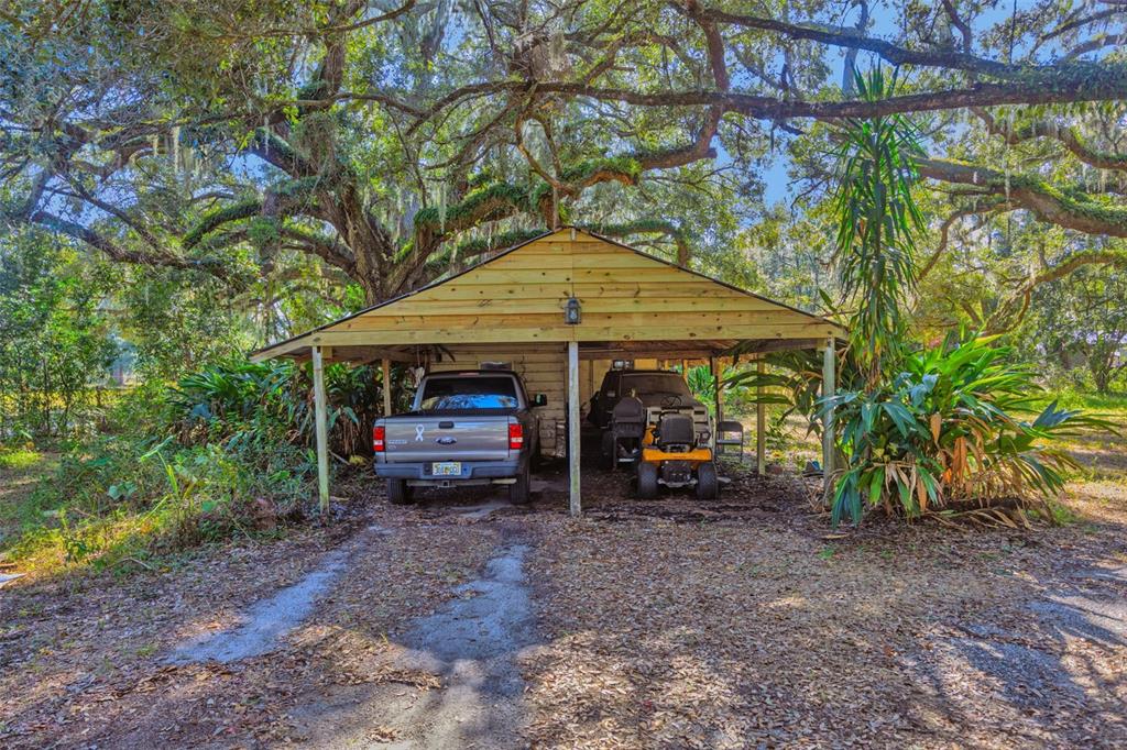 9580 McIntosh Road Dover, FL 33527 - Photo 5 of 15 a view of a house with backyard and sitting area