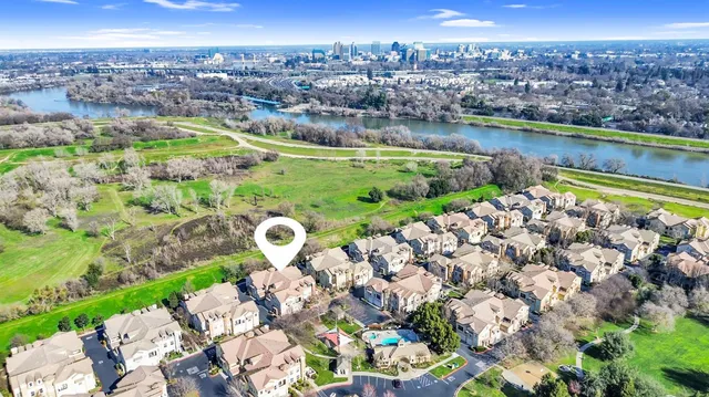 a view of a dining room with furniture and a window