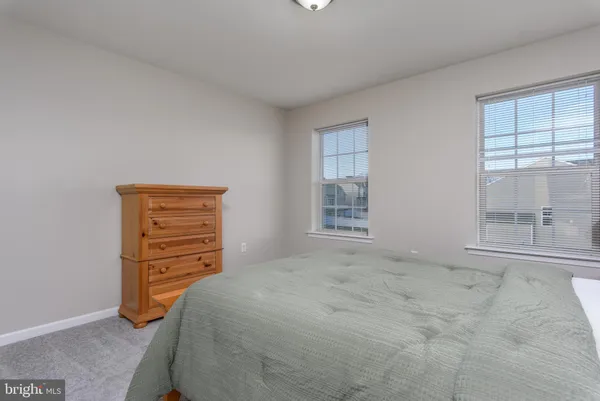 a bedroom with a bed and a night stand
