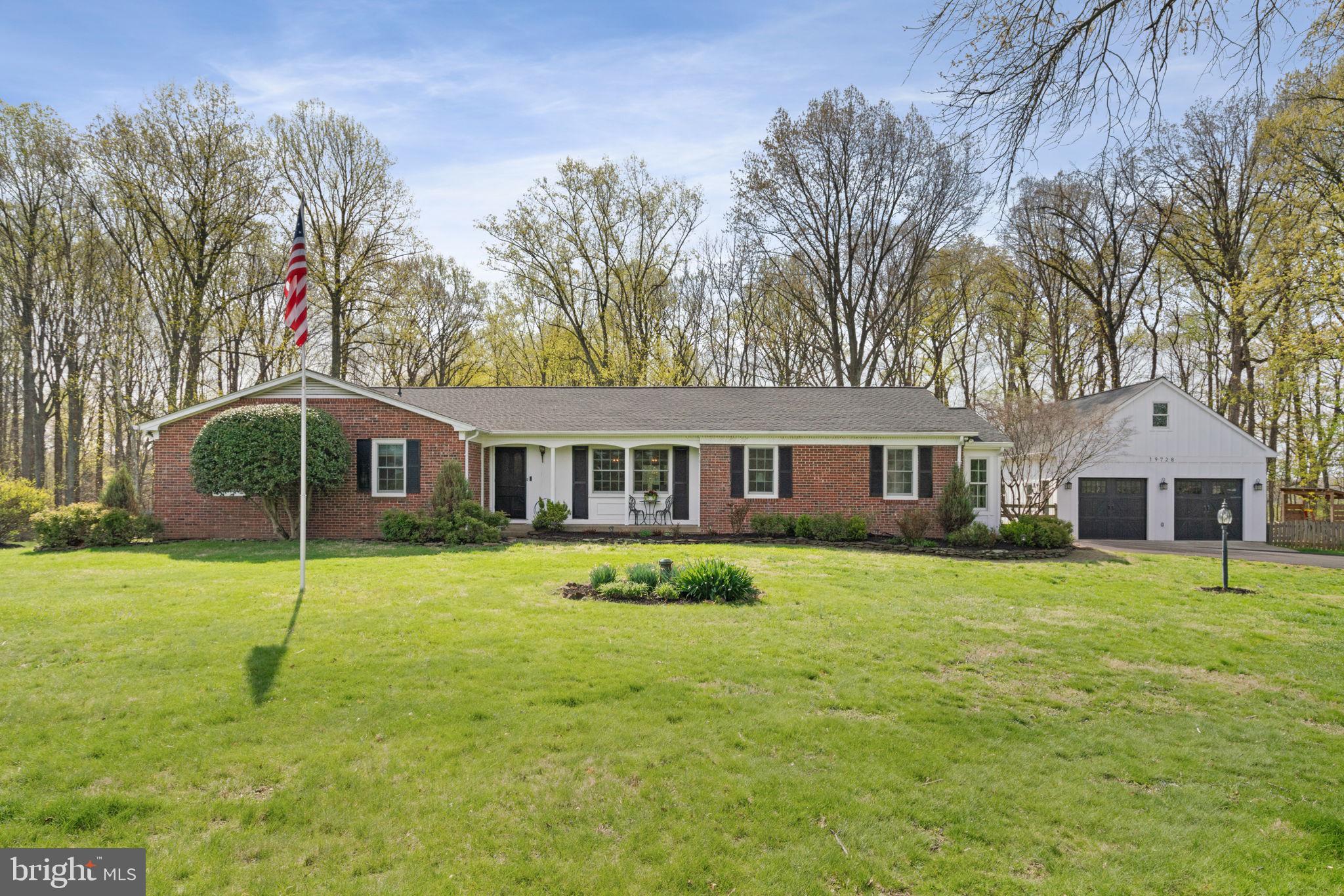 19728 Gleedsville Road Leesburg, VA 20175 - Photo 1 of 61 Charming brick home with lush greenery.