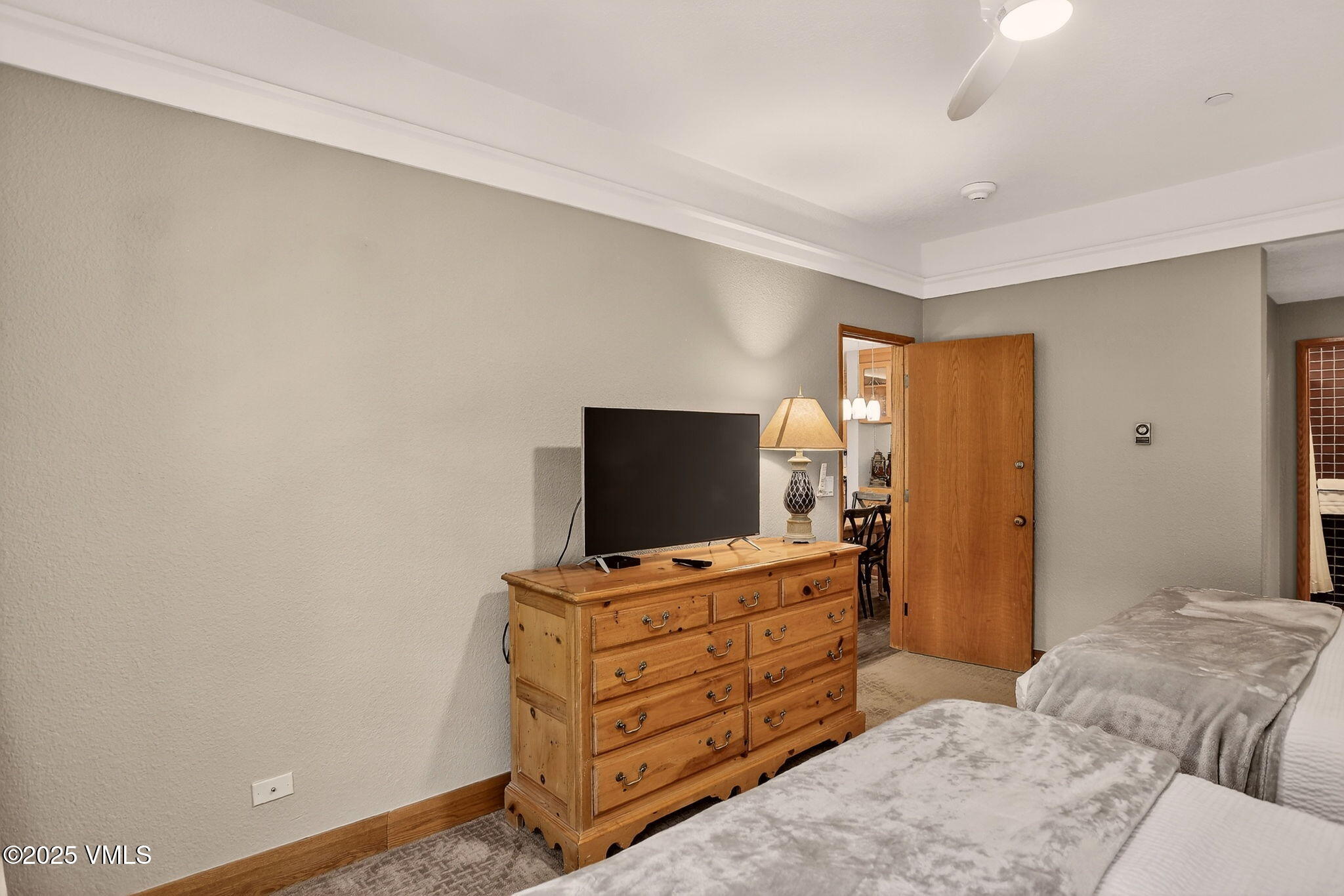 120 Offerson Road, Unit 5160 Beaver Creek, CO 81620 - Photo 13 of 30 a bedroom with a bed and flat screen tv