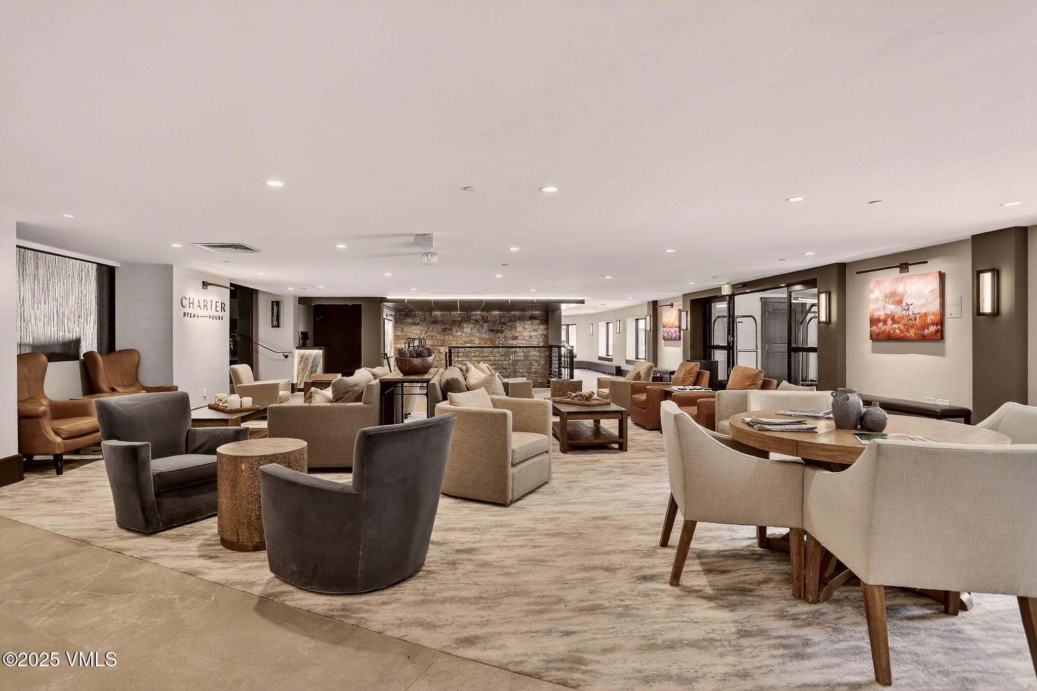 120 Offerson Road, Unit 5160 Beaver Creek, CO 81620 - Photo 29 of 30 a living room with lots of furniture and view of kitchen