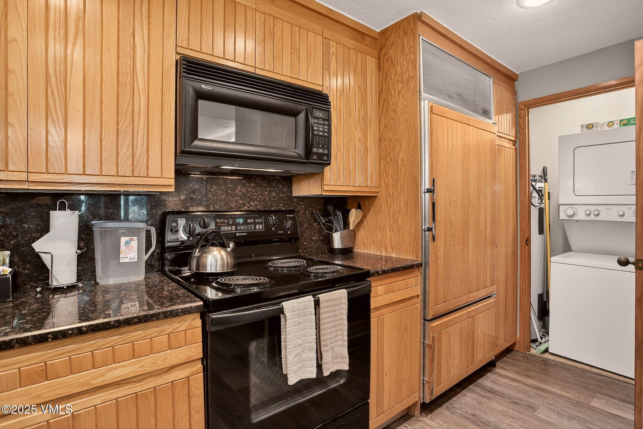 120 Offerson Road, Unit 5160 Beaver Creek, CO 81620 - Photo 8 of 30 a kitchen with stainless steel appliances granite countertop a stove a sink and a microwave
