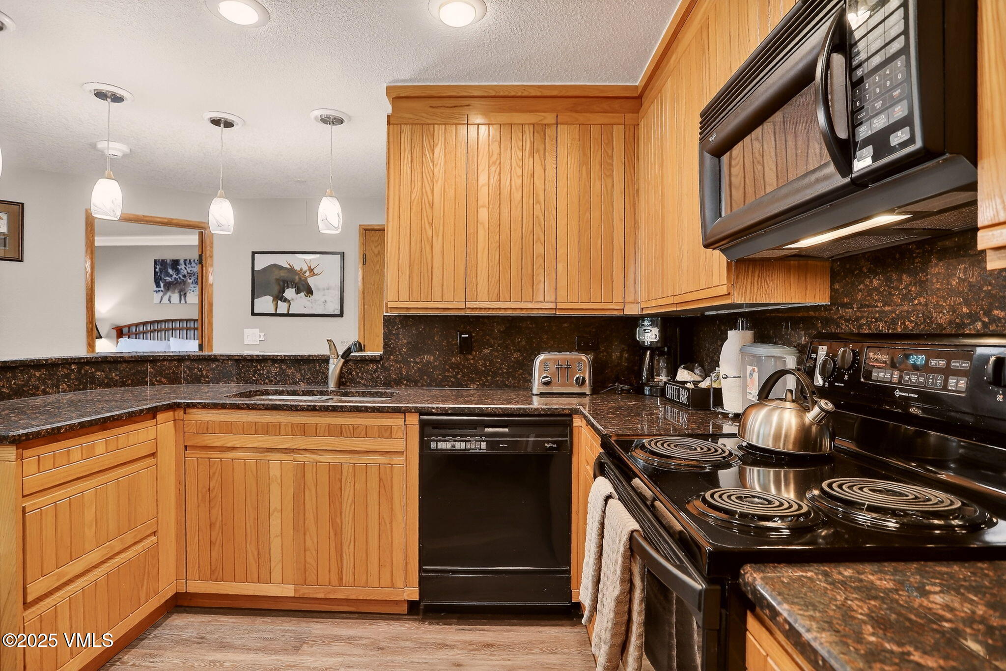 120 Offerson Road, Unit 5160 Beaver Creek, CO 81620 - Photo 9 of 30 a kitchen with a stove and a sink
