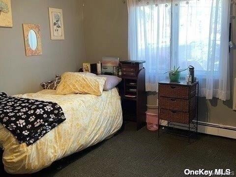 721 Meadow Road Smithtown, NY 11787 - Photo 9 of 10 a bedroom with a bed and window
