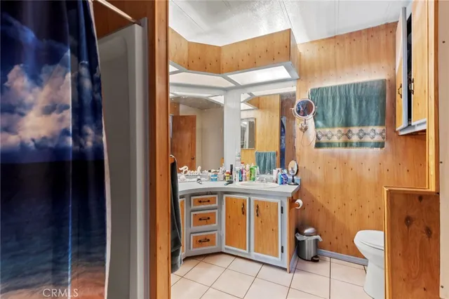 a bathroom with a sink double vanity and a mirror