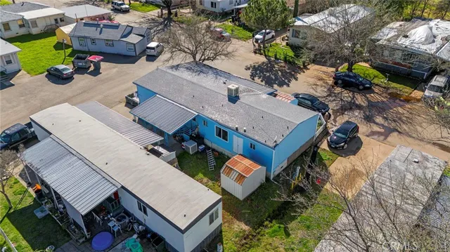 an aerial view of houses with outdoor space